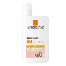 A bottle of la roche-posay sunscreen with an spf of 50+. the packaging is predominantly white with orange and black text detailing the product name and features.