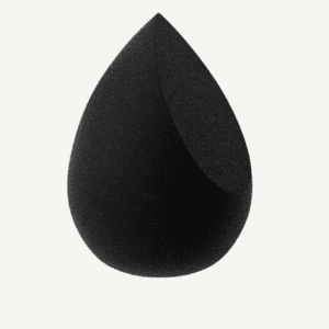 A black beauty blender makeup sponge on a white background, shaped like a teardrop, commonly used for applying foundation and other cosmetic products.