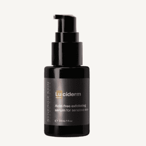 A black bottle of luciderm exfoliating serum with a pump dispenser on a white background. the label includes text about the product being acid-free and suitable for sensitive skin.