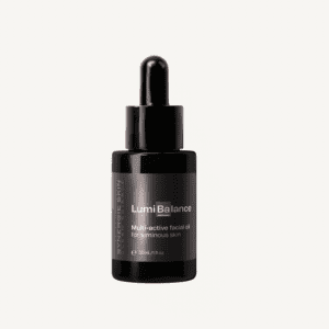 A black dropper bottle of lumibalance facial oil isolated on a white background, labeled for luminous skin, 30 ml.