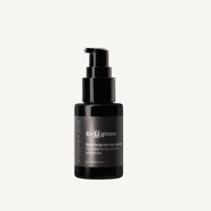 A black pump dispenser bottle labeled "en li lighten" for skin brightening serum, isolated on a white background.