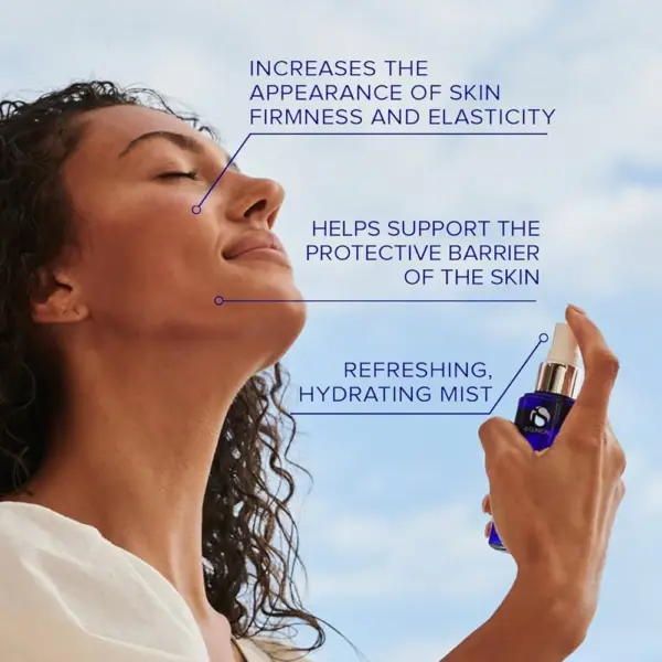 A woman with curly hair sprays Copper Firming Mist 75ml from a blue bottle onto her face. Text highlights benefits: firmer, more elastic skin, enhanced skin barrier support, and intense hydration.
