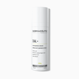 A white bottle of Dermaceutic Dual+ Anti-Blemish Serum is displayed against a white background, with the label featuring key ingredients: azelaic acid, potassium azeloyl diglycinate, niacinamide, and alpha-arbutin.